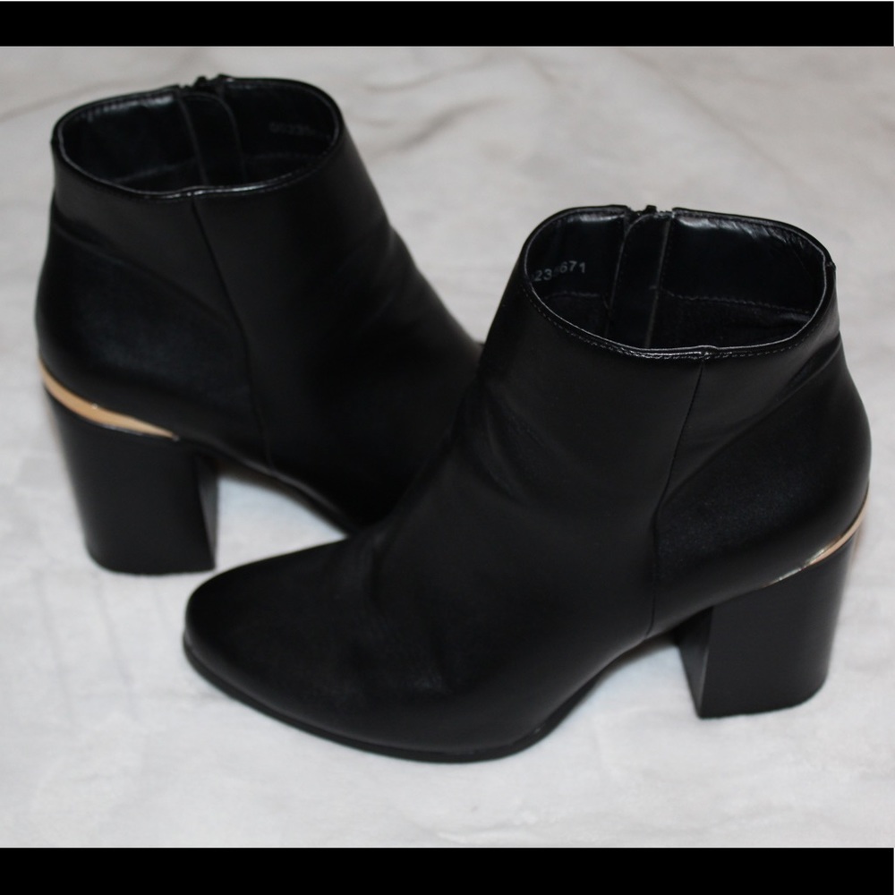 Black and gold boots